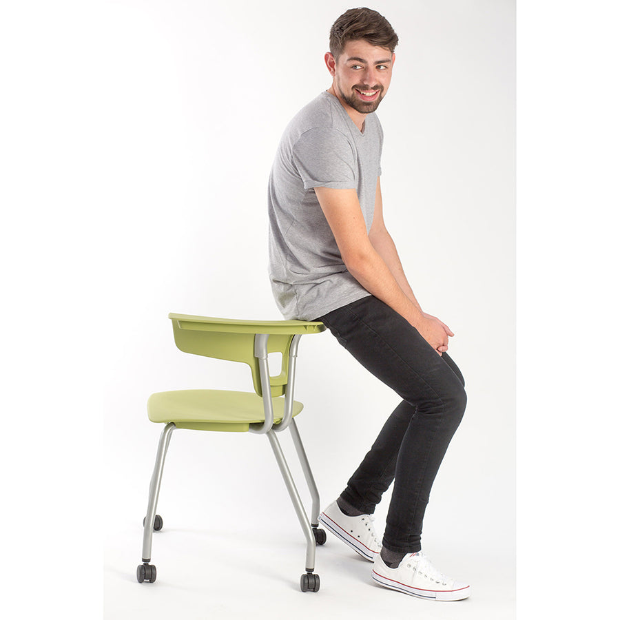 Ruckus 4 Leg Chair with castors starlight silver frame with zesty lime seat and back lifestyle image 1