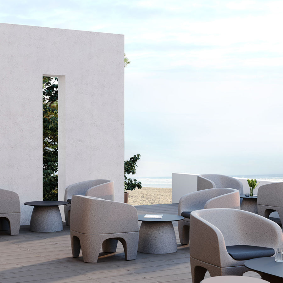 Gummy Bear Moulded Leg Outdoor Chair Grey Melange with Seat Pad and Gummy Bear Single Table Grey Melange Beach Lifestyle Image