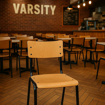 Chair in a restaurant with 'Varsity' sign on the wall